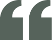 Opening quotation mark symbol in dark color.